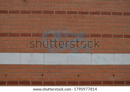 A photograph of a graffiti with the name 'vote' on a wall.
