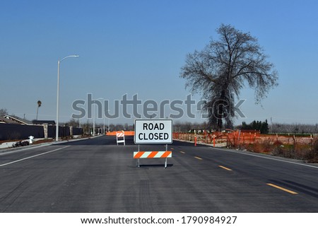 A Road closed ahead sign