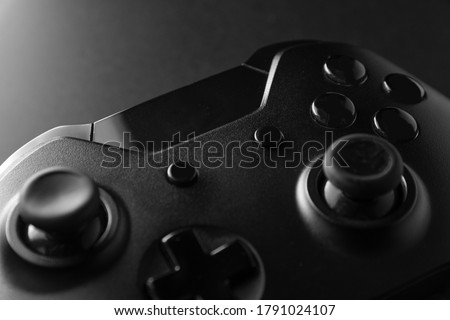 Black game controller in close view Royalty-Free Stock Photo #1791024107