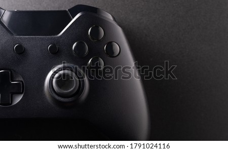 Black game controller in close view Royalty-Free Stock Photo #1791024116