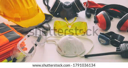 Work safety protection equipment flat lay. Industrial protective gear on white background, closeup view. Construction site health and safety concept Royalty-Free Stock Photo #1791036134