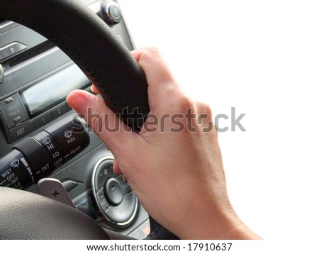 Hand female on a car wheel
