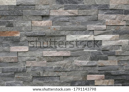 Decorative wall made of narrow marble tiles