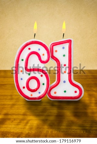 Burning birthday candles number 61