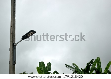 this pic show the LED solar street light on the pole at rain day