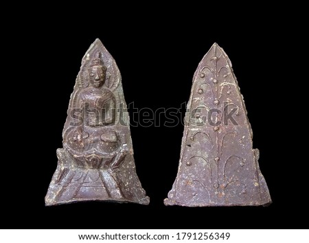 view front and back of ancient lead buddha statue plate cover with old red patina isolated on black background, Shan art 17th.-18th. Century, origin from Myanmar.