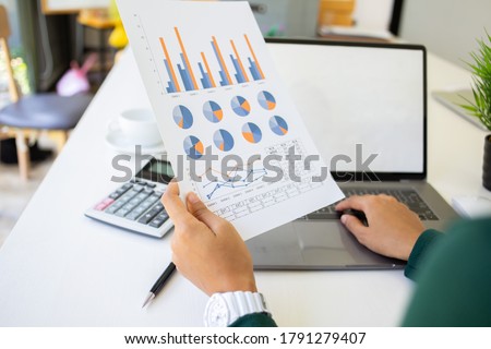 close up hand Team business Present Annual profit on desk about at home office.concept