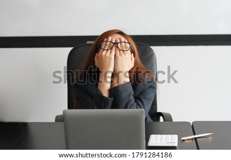Concept Burnout Syndrome. Asian  business Woman feels uncomfortable working. Which is caused by stress, accumulated from unsuccessful work And less resting body. Consult a specialist psychiatrist. Royalty-Free Stock Photo #1791284186
