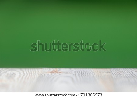 Wood table on blur abstract nature green background with copyspace