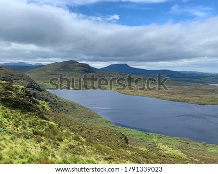 Seven Sisters, part of the Derryveagh mountains in Donegal, Ireland, viewed from a distance over the Lough at Termon Lower Barnes