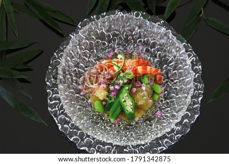 Simmered assorted summer vegetables and japanese tiger prawn.