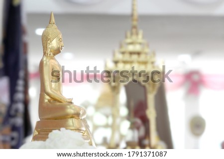 Beautiful golden yellow Buddha statue in Thailand