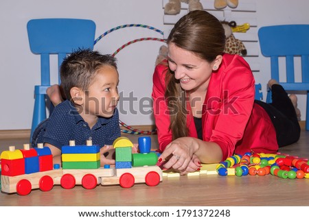 Speech Therapist During Private Language Lesson at Office Royalty-Free Stock Photo #1791372248