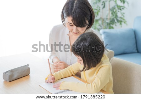 Asian mom teaching study in the room