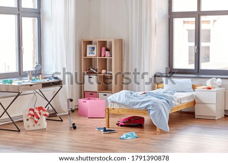 mess, disorder and interior concept - view of messy home kid's room with scattered stuff Royalty-Free Stock Photo #1791390878