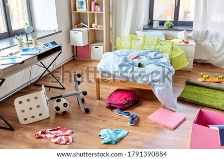 mess, disorder and interior concept - view of messy home kid's room with scattered stuff Royalty-Free Stock Photo #1791390884