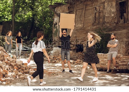 Dude with sign - man stands protesting things that annoy him. Solo demonstration his right to talk free on the street with sign. Copyspace for text. Opinion heard by public. Social life, humor, meme. Royalty-Free Stock Photo #1791414431
