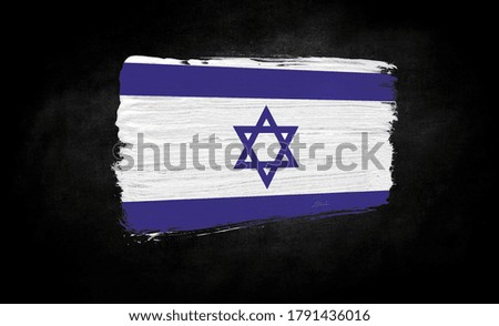 smear of paint in the form of the flag of Israel close-up on a black background