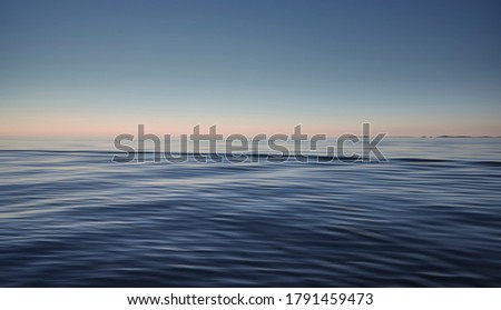Blue sea and sky background. Waves shot at long exposure. Backdrop for ocean stories