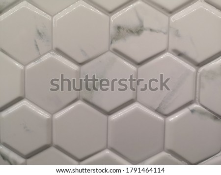 Hexagonal white-gray​ marble​ mosaic​ ceramic​ wall