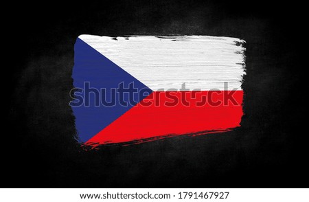 smear of paint in the form of the flag of Czech Republic close-up on a black background