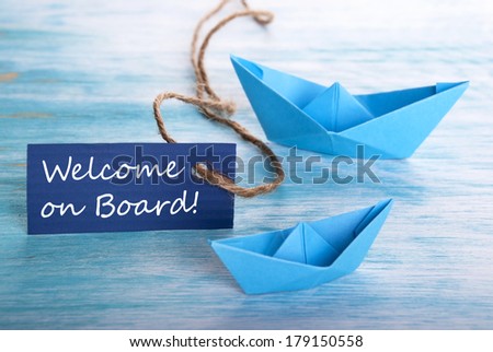 Label with Welcome on Board and Boats as Background