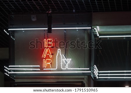 
Signboard bar and cocktail neon showcase on dark background.