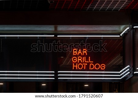 Signboard bar and cocktail neon showcase on dark background.