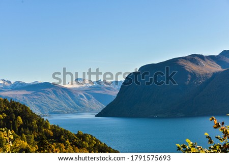 Norwegian landscape, view of the lake and mountains at sunset