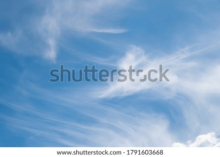 Clouds in the sky. Blue sky with white clouds in windy weather. Natural landscape background. Beautiful wallpaper for editing and design.