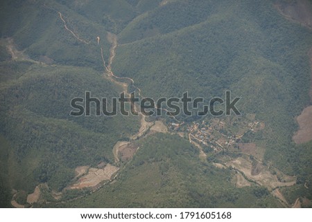 Village state on hill lower view from sky