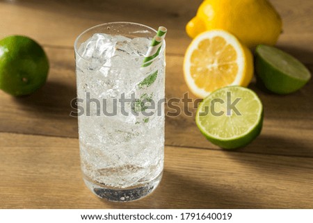 Refreshing Cold Lemon Lime Soda with a Straw