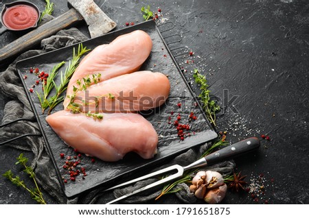 Meat. Raw chicken fillet with spices. Top view. Rustic style. Royalty-Free Stock Photo #1791651875