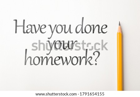 Pencil with a phrase HAVE YOU DONE YOUR HOMEWORK? on white background, top view 