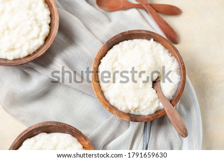 flat lay photography showing rice pudding served in wooden bowls