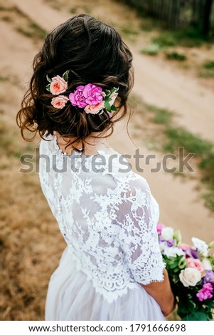 flower wreath in the hair, decoration on the head of the bride from fresh flowers, wedding day, image of the bride Royalty-Free Stock Photo #1791666698