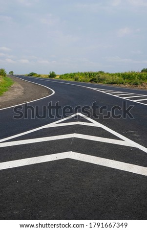 New road. Road markings. Fresh paint. National Great Construction project. Copy space. Vertical image.