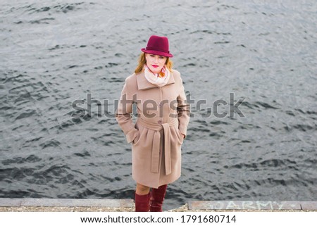 Young Woman Beige Coat Hat Girl Posing River Background Photo