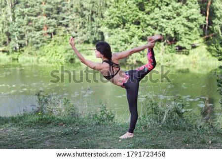 40 years old woman doing yoga outdoors in the morning