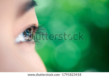 Macro of eye or eyeball black color of asian woman with eyebrow, eyelash and eyelid in concept eye health and vision in life Royalty-Free Stock Photo #1791823418