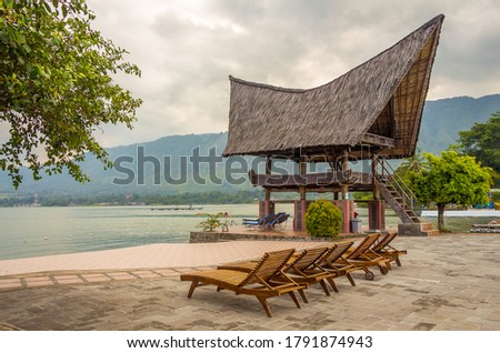 A view of Lake Toba from the shore of Parapat, Samosir Island, North Sumatra, Indonesia Royalty-Free Stock Photo #1791874943