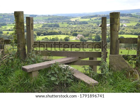 Wooden Foot Stile With View Over Lancashire Countryside Royalty-Free Stock Photo #1791896741