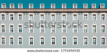 Building exterior with windows and sky.