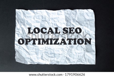 black calculator with text Local Seo Optimization on the white background