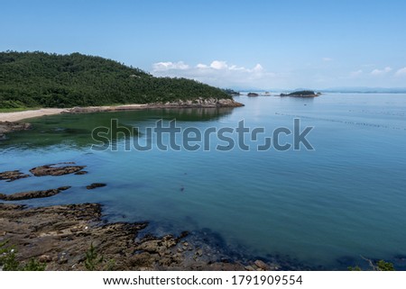 Jindo island summer ocean view with a small remote island in the distance