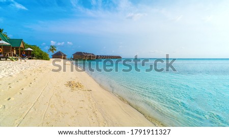 Top view of beautiful beach. Aerial drone shot of turquoise sea water at the beach - space for text. Caribbean seaside beach with turquoise water and big waves aerial view. Cancun beach aerial view.