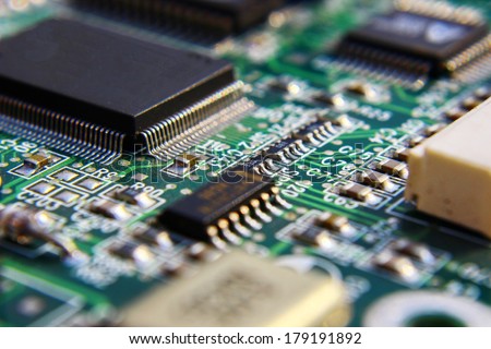 Printed Circuit Board with many electrical components. Royalty-Free Stock Photo #179191892