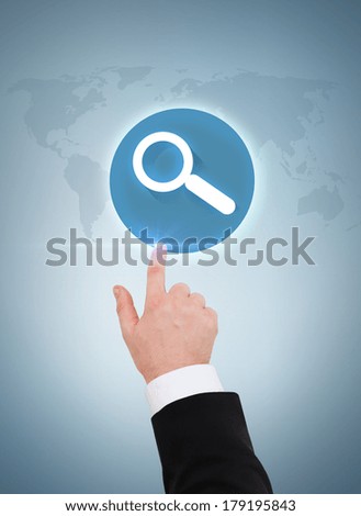 business and advertisement concept - close up of businessman pointing to magnifying glass