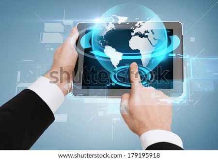 business, internet and technology concept - close up of man hands touching tablet pc with globe hologram