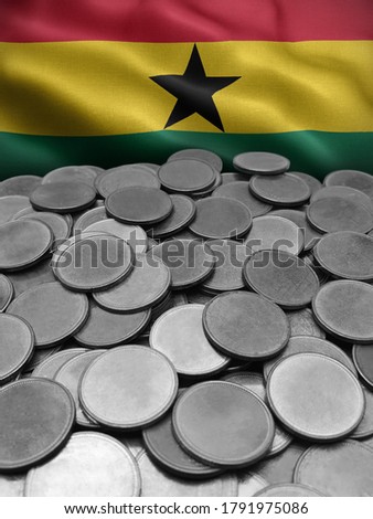 coins isolated on Ghana flag background.